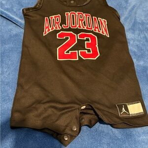 Jordan Black Baby Bodysuit with Red Jumpman Logo